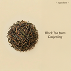 Black tea leaves from Darjeeling on a beige background with text.